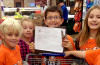 Loveland students blend learning with giving for a holiday treat for more than 80 families in need