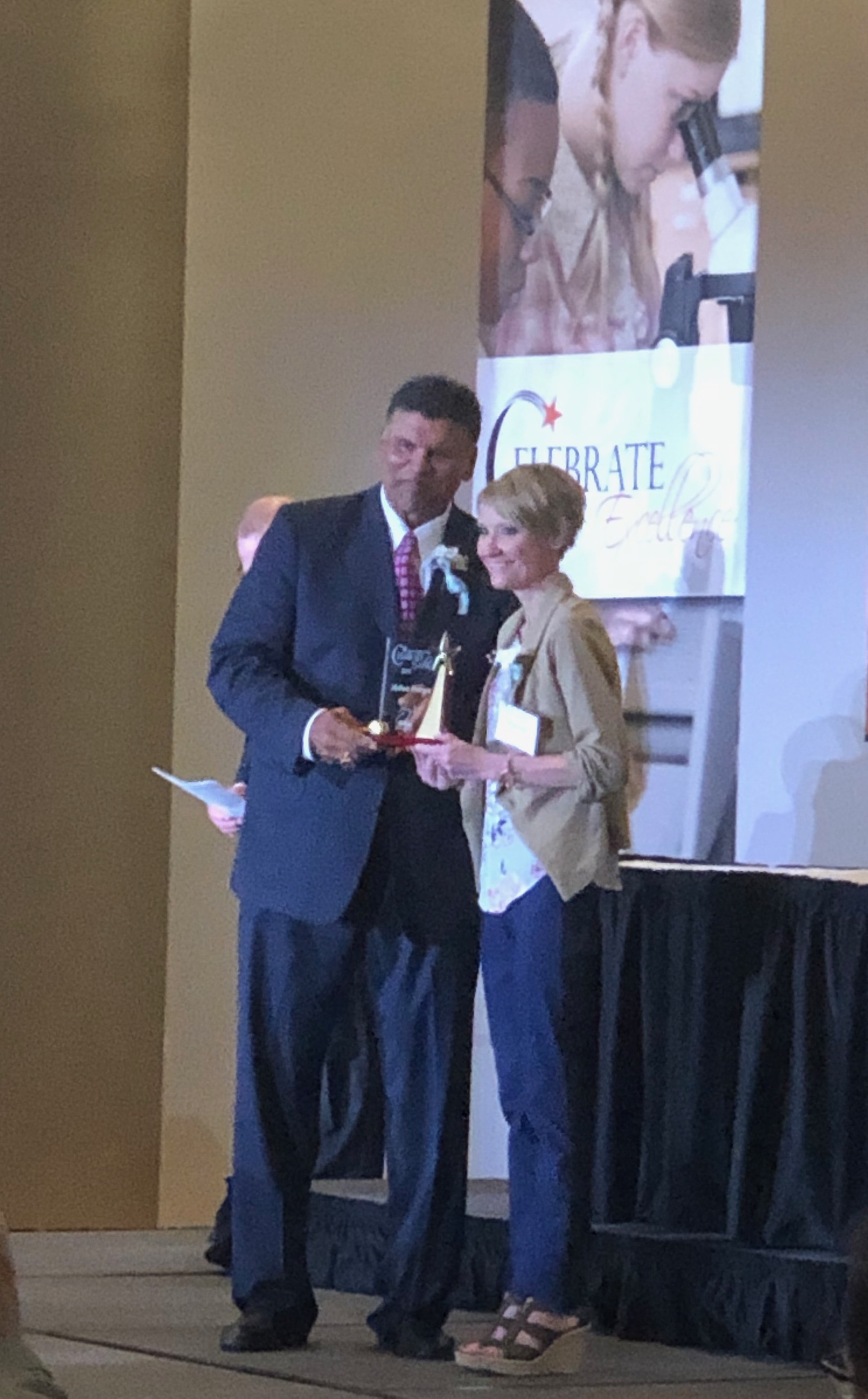 Anthony Munoz, Master of Ceremonies, presented the 2019 Celebrate Excellence Award to Melissa Prenger, teacher at Loveland Elementary School.