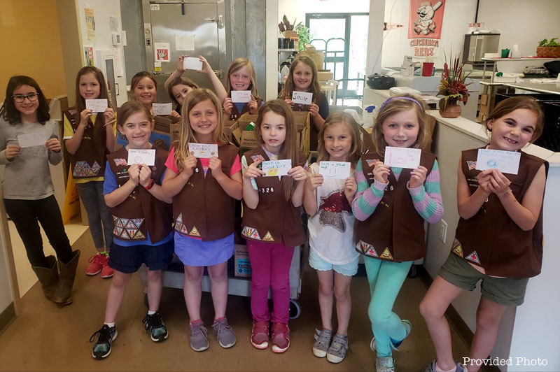 Troop 44326 from Loveland donated boxes of cookies for Meals on Wheels