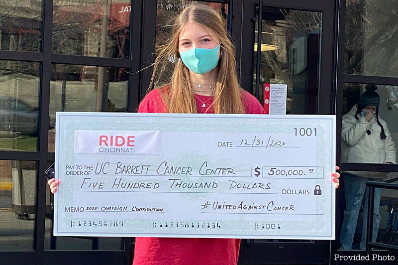 Loveland Middle Schooler Emma Rudnicki presents 1/2 million dollar check for local cancer research