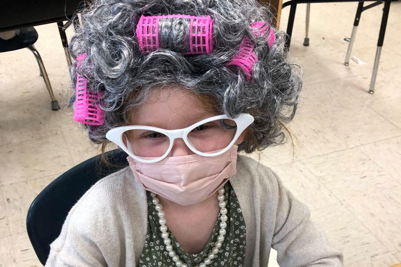 Celebrating the 100th day of school by dressing up as 100-year-olds