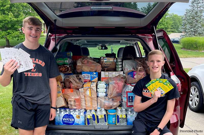 Loveland High School Students Brady and Connor Burns come to aid of Goshen tornado families