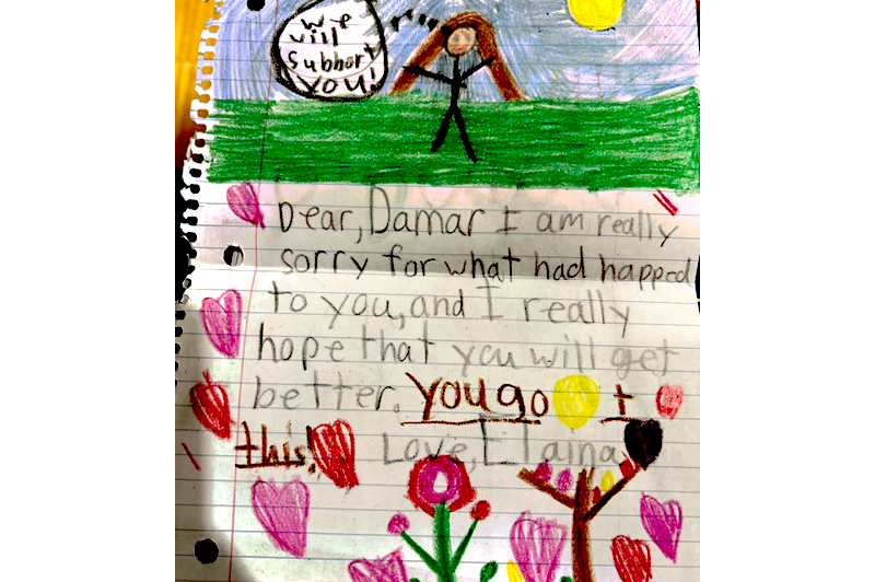 Loveland Elementary’s Lyla leads in saying “Get Well” to Damar Hamlin