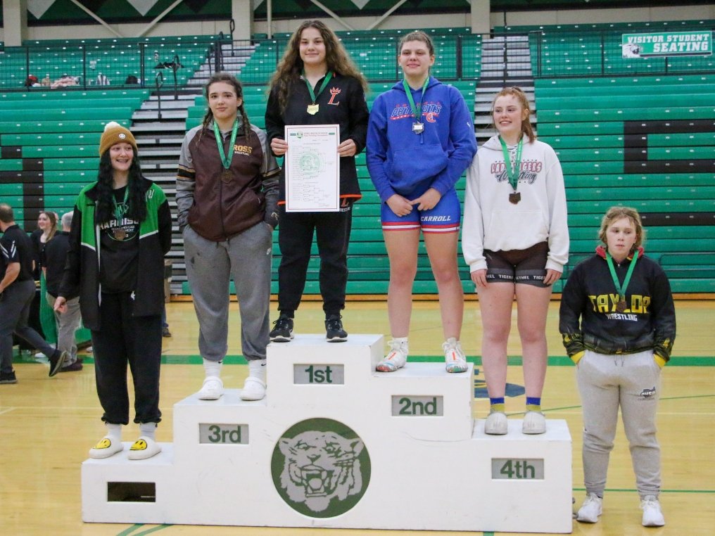 Elizabeth Madison is the first Loveland female wrestler to punch her ticket to State